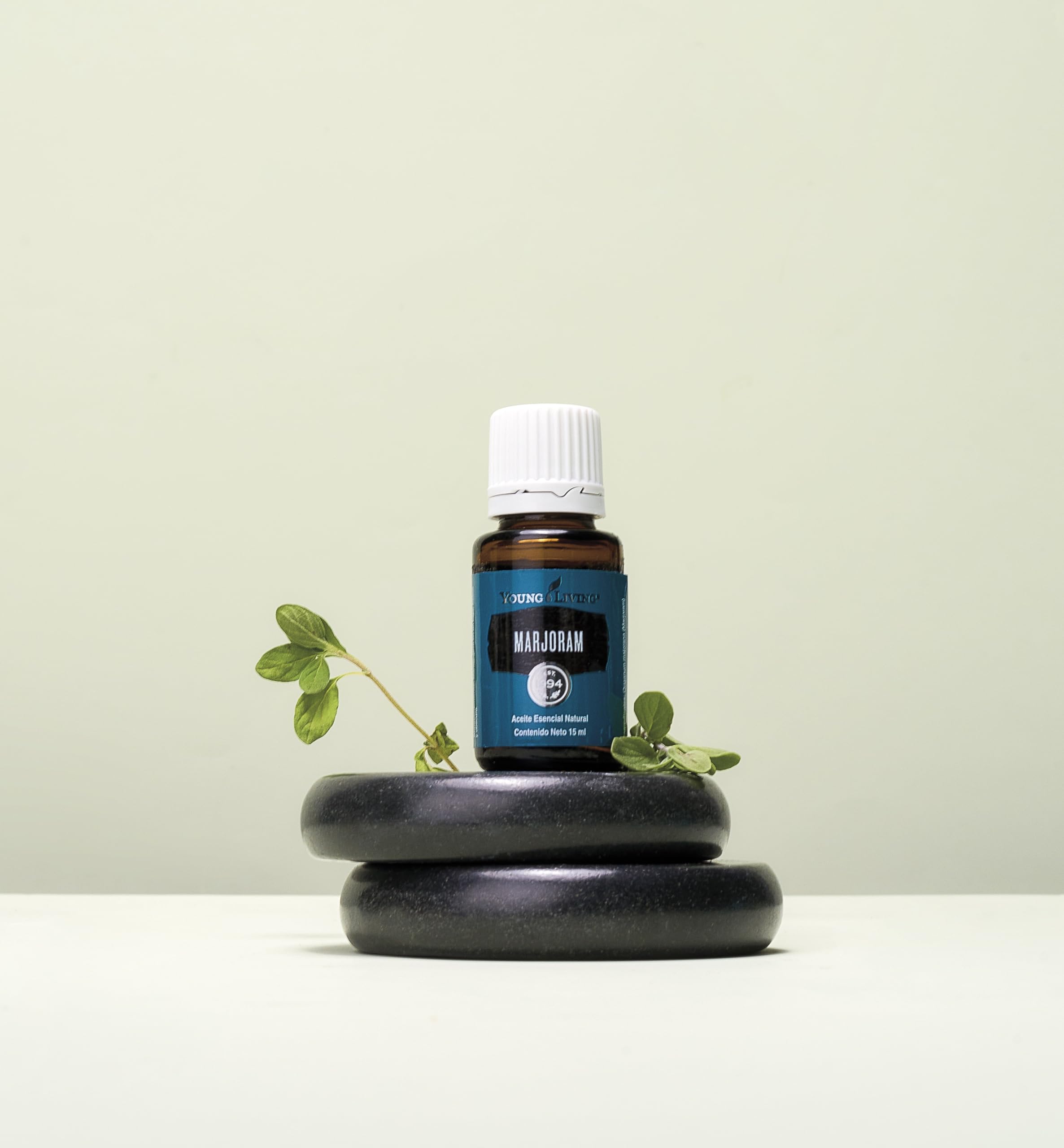 Fresh marjoram leaves to symbolize the herbal origin and calming aroma.