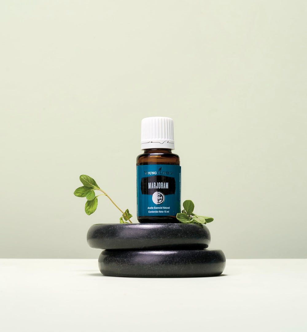 Fresh marjoram leaves to symbolize the herbal origin and calming aroma.