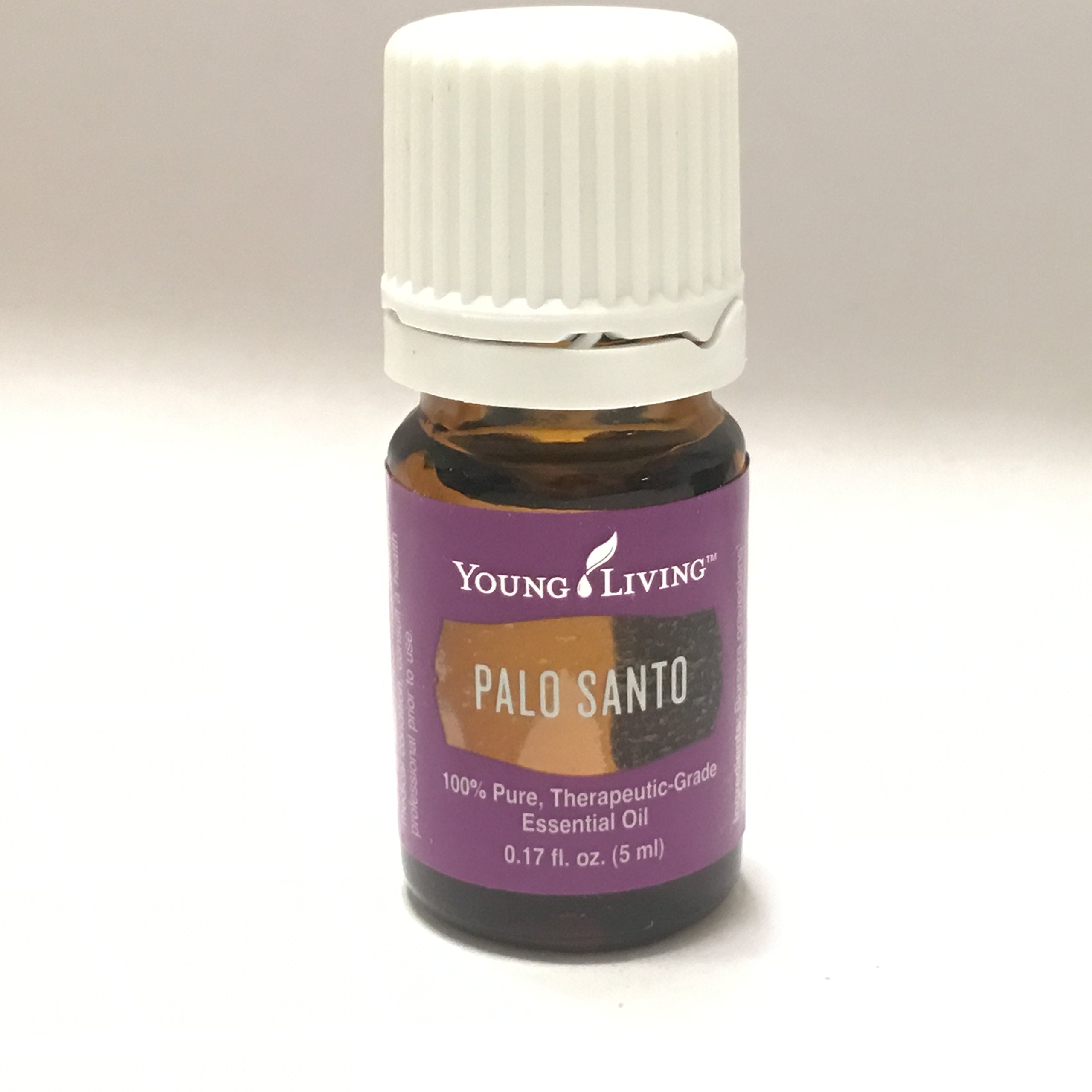 Closeup of Palo Santo wood notes from Young Living oil highlighting authentic aroma for meditation.