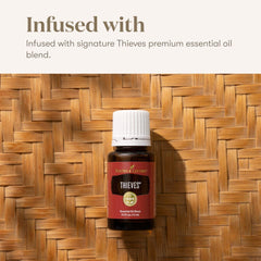 Mint leaves beside Young Living Thieves drops suggest a refreshing flavor.