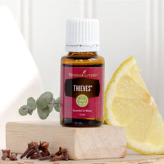 Young Living Thieves packaging scene highlights premium 100 percent pure oils.
