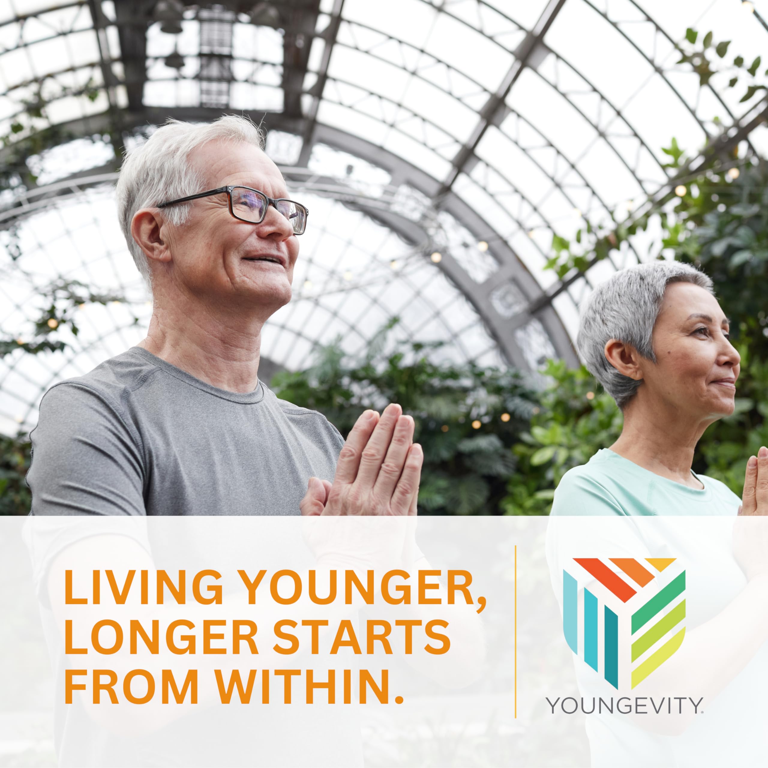 Youngevity Beyond Tangy Tangerine 2.0 bottle with glass ready to enjoy daily nutrition.
