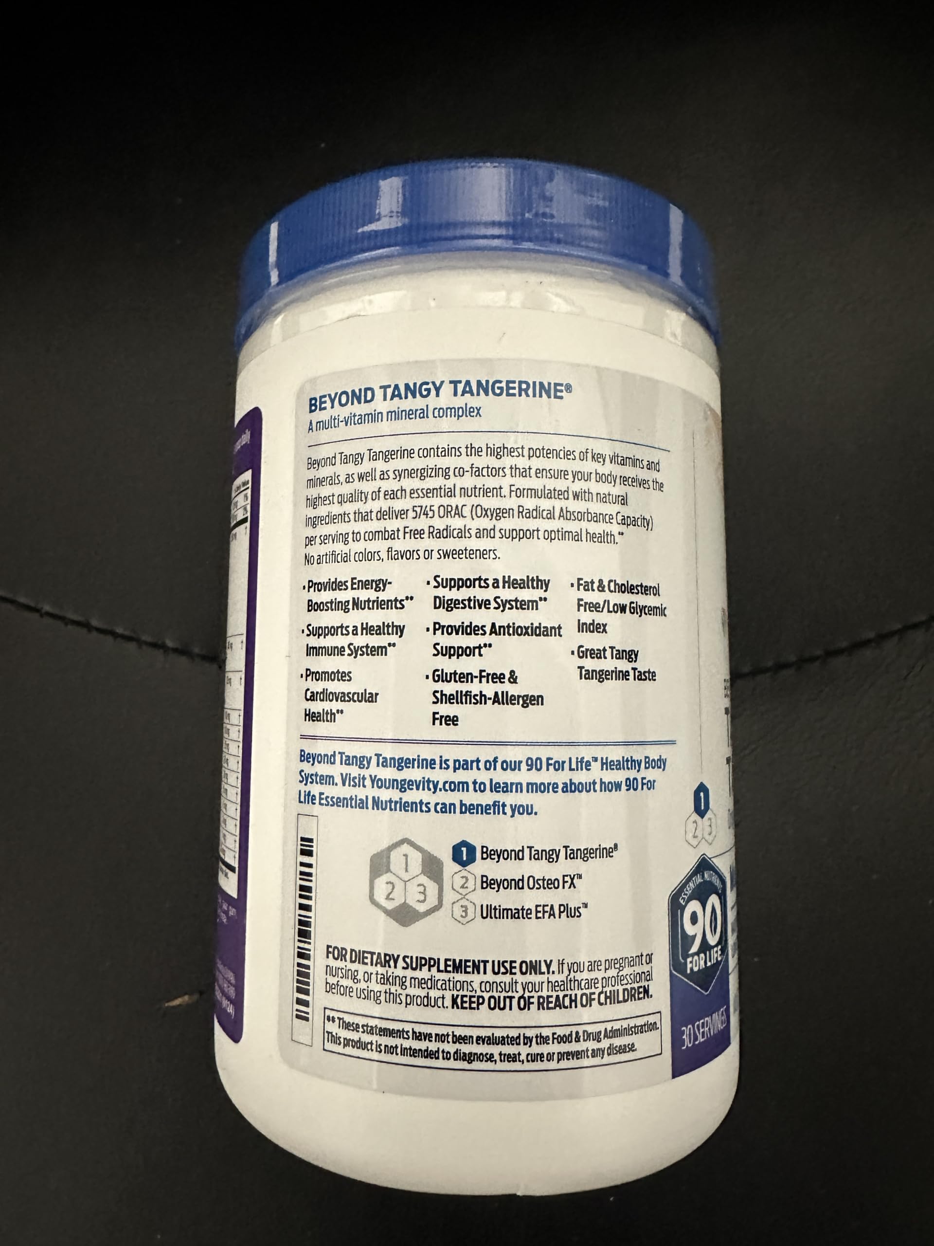 Six-pack sleeve of Beyond Tangy Tangerine on shelf for ongoing use