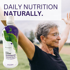 Youngevity Ultimate Classic glass with bottle in everyday setting.