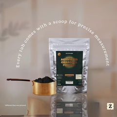 Zen Principle charcoal powder applied to skin for a cleansing mask.