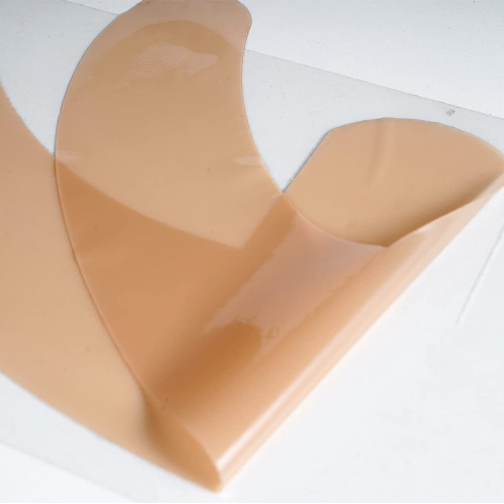 Application of ZODENIS scar sheets on breast scar area post-surgery.
